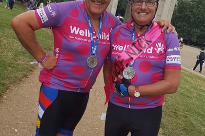 Fundraising pair pedal to the palace for Well Child charity