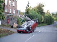 Car flipped on roof after crash