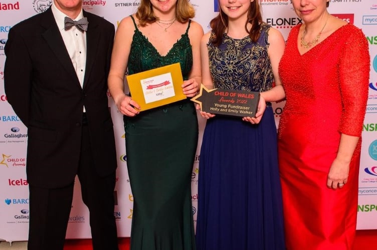 Holly and Emily Walker with their parents, Tim and Debbie, at the Child of Wales Awards 2022 in Cardiff