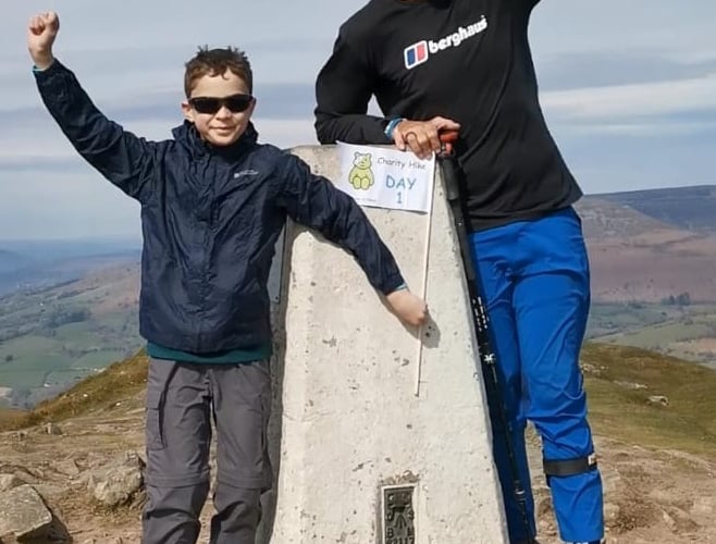 Dante, 10, with TV star Ed on top of the Sugarloaf during his mammoth challenge