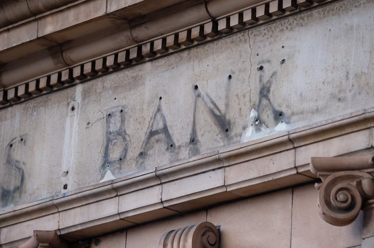 The remains of a sign over a former branch of Barclays Bank, now closed, in Kew Gardens, south west London.