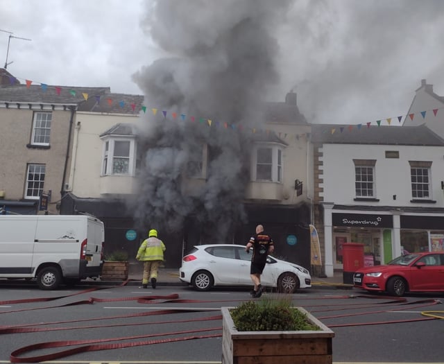 40 fire crews tackled blaze which gutted shop