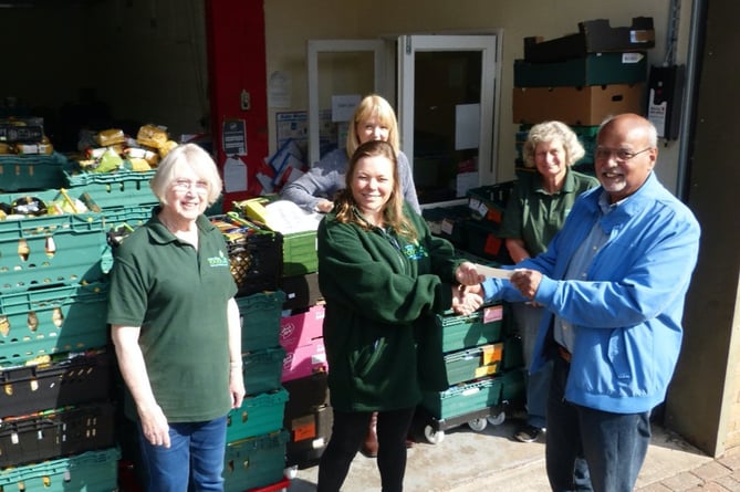 Pic of members of Pontypool food bank receiving a cheque from Monmouth Catanians