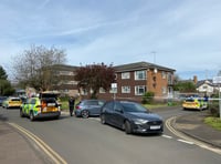 Man in hospital and woman arrested following car incident