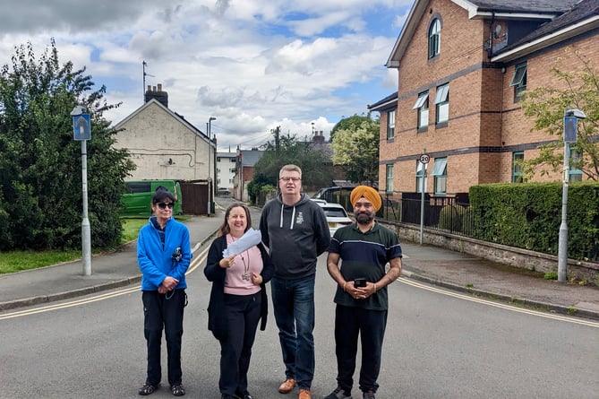 Justine Johnson with the petition on Goldwire Lane with fellow closure opponents (from right) Best-one shop owner Bal Sorinder Singh, town councillor Martin Newell and Rachael Davies.    