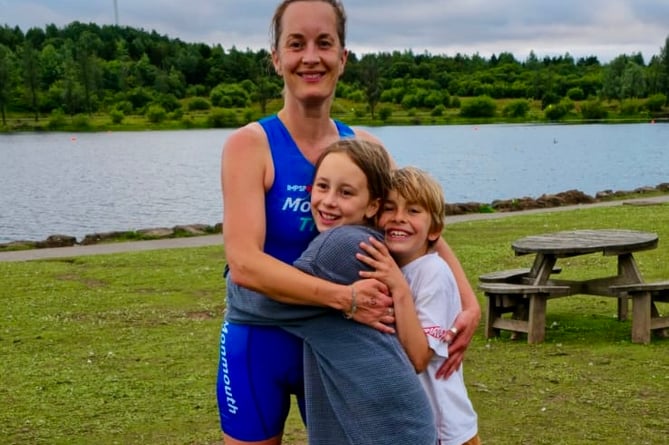 Kelly Major and supporters Fred and Ella celebrate at the NEWT Parc Bryn Bach aquathlon