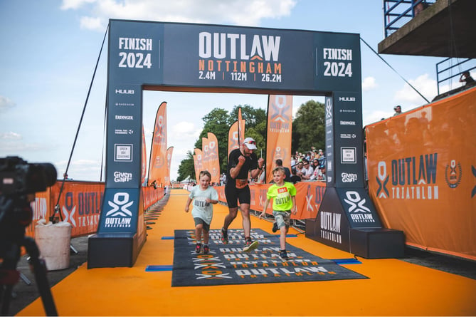 James Peters and his boys celebrate at the finish