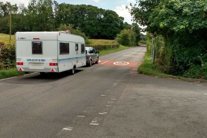 A car, towing a caravan, along Crick Road, Crick heading towards a field identified as a potential Gypsy Traveller site. Picture: LDRS