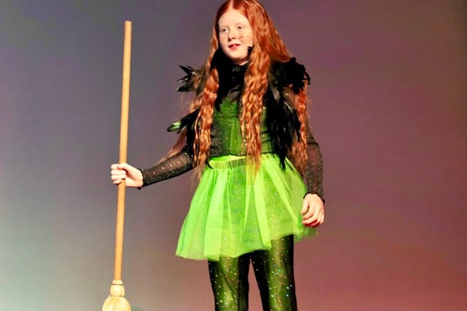 Broomstick at the ready for a witch