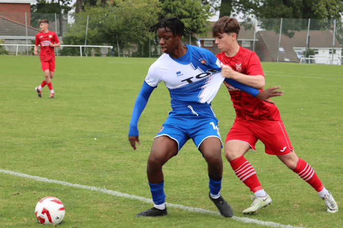 A Chepstow player shields the ball