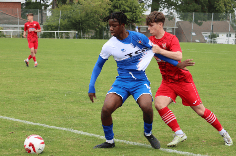 A Chepstow player shields the ball