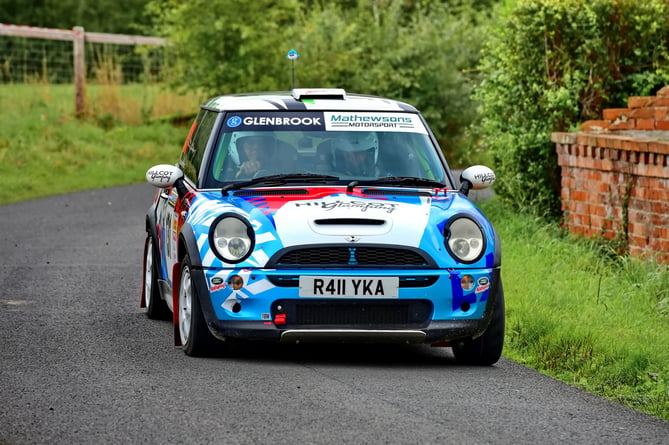 Andrew Price and Adam Jones in their modern Mini Cooper