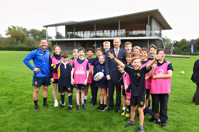 Prince Edward with Academy director Richie Rees and some budding rugby stars