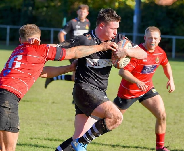 Usk squeeze home by a point