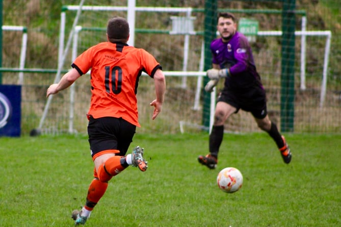 Dan MacDonald closes in on goal