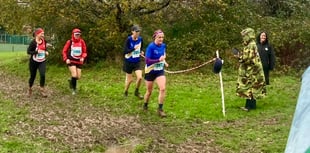 Runners brave the weather to storm home