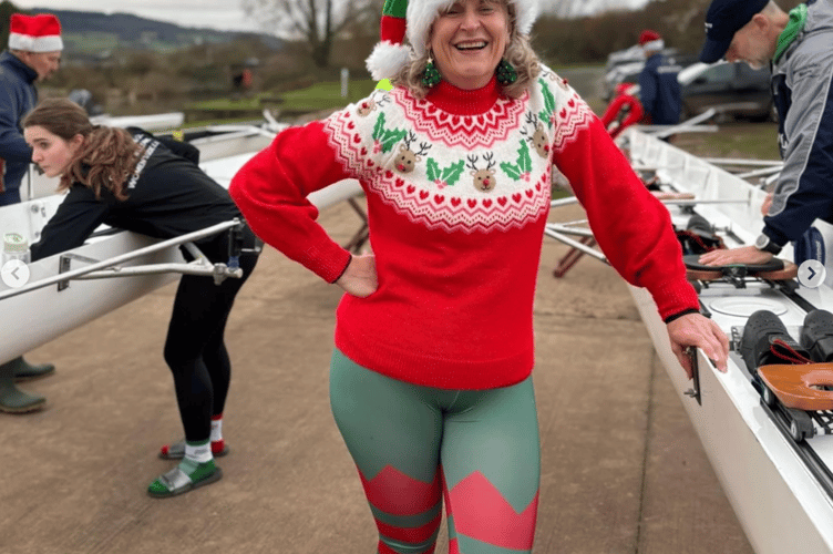 A rower gets ready to boat in festive gear