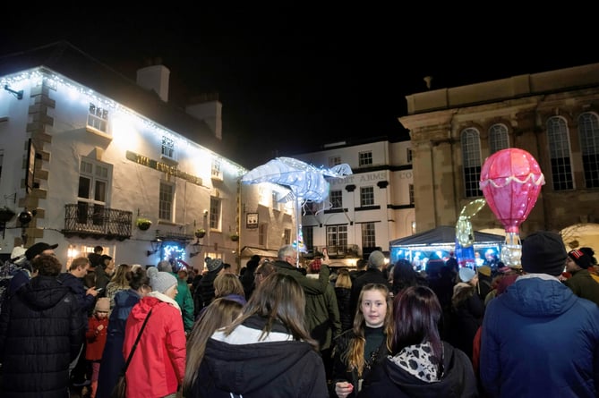 The square was aglow with lanterns