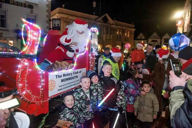 Santa, with the help of rotary, gave out gifts and posed for pictures