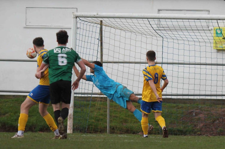 Mon keeper Ethan Ross saves