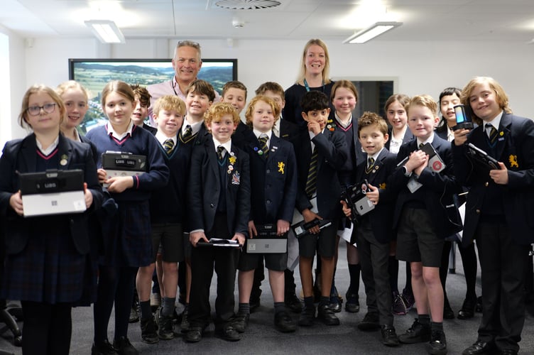 Students with Escape to the Country presenter Jules Hudson